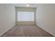 Bedroom featuring carpeted floors and a bright, window-lit atmosphere at 16 W Encanto Blvd # 305, Phoenix, AZ 85003