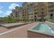 Beautiful landscaping in the courtyard with water feature near the building at 16 W Encanto Blvd # 305, Phoenix, AZ 85003