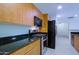 Modern kitchen with stainless steel appliances and granite countertops at 16 W Encanto Blvd # 305, Phoenix, AZ 85003