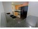 Modern kitchen with stainless steel appliances and black granite countertops at 16 W Encanto Blvd # 305, Phoenix, AZ 85003