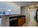 Modern kitchen with stainless steel appliances and breakfast bar seating at 16 W Encanto Blvd # 305, Phoenix, AZ 85003