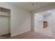 The living room is carpeted and has access to a closet, kitchen, and other rooms at 16 W Encanto Blvd # 305, Phoenix, AZ 85003