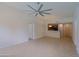 Open living space with tile flooring, a large ceiling fan, and adjacent kitchen at 16 W Encanto Blvd # 305, Phoenix, AZ 85003