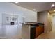 Living room and kitchen area with tile flooring, a fireplace, and modern lighting at 16 W Encanto Blvd # 305, Phoenix, AZ 85003