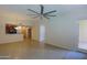 Open living space with tile flooring, ceiling fan, and sliding door to outdoor patio at 16 W Encanto Blvd # 305, Phoenix, AZ 85003
