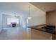 Bright living room with tile flooring, a fireplace, ceiling fan, and adjacent kitchen area at 16 W Encanto Blvd # 305, Phoenix, AZ 85003