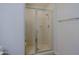Shower with glass door enclosure and tile surround, creating a clean and modern bathing space at 16 W Encanto Blvd # 305, Phoenix, AZ 85003