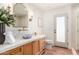 Stylish bathroom features a vanity with marble countertop, decorative mirror, and walk-in shower at 16227 N 63Rd Pl, Scottsdale, AZ 85254
