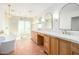 Luxurious bathroom features a soaking tub, glass enclosed shower, double vanity, and warm tile floors at 16227 N 63Rd Pl, Scottsdale, AZ 85254