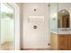 Bright bathroom featuring a tiled shower with a built-in niche and a vanity with marble countertop at 16227 N 63Rd Pl, Scottsdale, AZ 85254