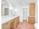 Beautiful bathroom with double vanity, marble counters, wood cabinets, and tiled floor at 16227 N 63Rd Pl, Scottsdale, AZ 85254