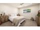 Comfortable bedroom featuring a neutral color scheme, modern furniture, and a large window at 16227 N 63Rd Pl, Scottsdale, AZ 85254