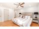 Airy bedroom with hardwood floors, ceiling fan, neutral color palette and lots of natural light at 16227 N 63Rd Pl, Scottsdale, AZ 85254