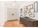 Inviting foyer features double doors, modern console table, and artistic wall decor at 16227 N 63Rd Pl, Scottsdale, AZ 85254