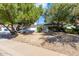 Well-maintained single-story home with mature landscaping and charming curb appeal at 16227 N 63Rd Pl, Scottsdale, AZ 85254