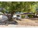 Well-maintained single-story home with mature landscaping and charming curb appeal at 16227 N 63Rd Pl, Scottsdale, AZ 85254