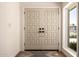 Stylish double front doors with modern hardware and a welcoming entryway at 16227 N 63Rd Pl, Scottsdale, AZ 85254