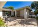 Front courtyard with tile flooring, outdoor seating, and mature landscaping at 16227 N 63Rd Pl, Scottsdale, AZ 85254