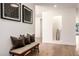 Stylish hallway features hardwood floors, bench seating, and modern decor at 16227 N 63Rd Pl, Scottsdale, AZ 85254