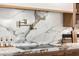 Close-up of kitchen with marble backsplash, counter, cooktop, and chef's faucet at 16227 N 63Rd Pl, Scottsdale, AZ 85254