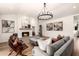 Inviting living room with a tiled fireplace, comfortable seating, and hardwood floors at 16227 N 63Rd Pl, Scottsdale, AZ 85254