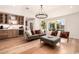 Spacious living room features a wet bar, comfortable seating, and hardwood floors at 16227 N 63Rd Pl, Scottsdale, AZ 85254