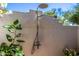 Inviting outdoor shower with modern fixtures, surrounded by lush greenery for privacy at 16227 N 63Rd Pl, Scottsdale, AZ 85254