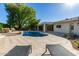 Inviting backyard pool with a water fountain and relaxing lounge area at 16227 N 63Rd Pl, Scottsdale, AZ 85254