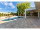 Inviting backyard pool with a water fountain and relaxing lounge area at 16227 N 63Rd Pl, Scottsdale, AZ 85254