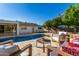 Backyard pool features fountains and patio seating, creating a serene space for outdoor enjoyment and relaxation at 16227 N 63Rd Pl, Scottsdale, AZ 85254