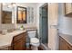 Cozy bathroom with a glass door shower, stylish countertop, and neutral decor at 1640 E Solano Dr, Phoenix, AZ 85016