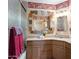 Bathroom featuring a unique vanity, wall mirror, and a shower/tub combo at 1640 E Solano Dr, Phoenix, AZ 85016