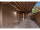 Covered carport area showing brick walls and ceiling, and a concrete floor at 1640 E Solano Dr, Phoenix, AZ 85016