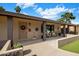 Welcoming front porch with seating area, decorative door, and vibrant landscaping adding curb appeal at 1640 E Solano Dr, Phoenix, AZ 85016