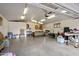 Large garage featuring concrete floors, overhead lighting, and ample space for storage and a work area at 1640 E Solano Dr, Phoenix, AZ 85016