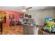 Comfortable living room with stylish sofa, terracotta tile, and views into the kitchen at 1640 E Solano Dr, Phoenix, AZ 85016