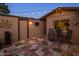 Charming backyard patio with tiled flooring, potted plants, and seating, creating a cozy and inviting outdoor space at 1640 E Solano Dr, Phoenix, AZ 85016