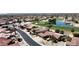 Residential neighborhood with a golf course nearby, featuring mature trees and tile roofs at 17406 N Escalante Ln, Surprise, AZ 85374