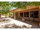 Expansive covered patio with dining and lounge areas, perfect for relaxing outdoors at 17406 N Escalante Ln, Surprise, AZ 85374