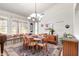 Dining room with seating for six and a view of the front of the house at 17406 N Escalante Ln, Surprise, AZ 85374