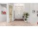 Bright foyer featuring elegant tile flooring, a decorative rug, and art at 17406 N Escalante Ln, Surprise, AZ 85374