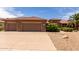 Spacious three-car garage with an extended driveway at 17406 N Escalante Ln, Surprise, AZ 85374