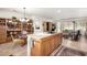 Open concept kitchen with island cooktop, eat-in dining and connected living area at 17406 N Escalante Ln, Surprise, AZ 85374