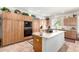 Well-appointed kitchen featuring light wood cabinets, modern appliances, and a functional center island at 17406 N Escalante Ln, Surprise, AZ 85374