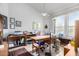 Home office featuring a large window, a desk, and ample storage space at 17406 N Escalante Ln, Surprise, AZ 85374