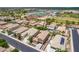 Stunning aerial view showcases homes and community near the high school with its stadium in the background at 1876 E Azalea Ct, Gilbert, AZ 85298