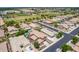 This is a beautiful neighborhood with lush green lawns and sparkling swimming pools in the backyard of a home at 1876 E Azalea Ct, Gilbert, AZ 85298
