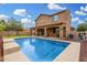 This home features a large in-ground swimming pool and playground at 1876 E Azalea Ct, Gilbert, AZ 85298