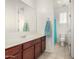 Bright bathroom featuring tile floors, vanity, and a walk in shower at 1876 E Azalea Ct, Gilbert, AZ 85298
