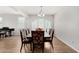 Well-lit dining room with wood floors and a decorative chandelier at 1876 E Azalea Ct, Gilbert, AZ 85298